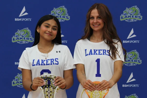 Two FLCC women's lacrosse players posing for a photo