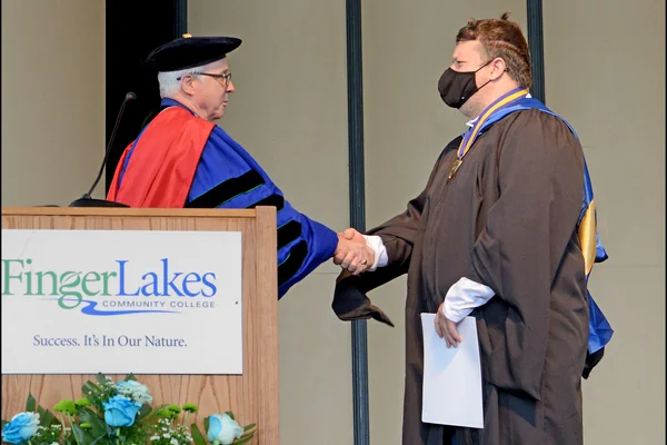 President presenting award to M. Van Etten