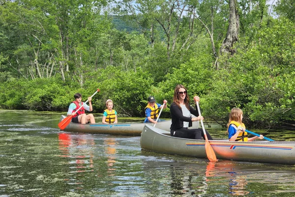 K-12 teacher and her students exploring Honeoye Inlet by canoe.