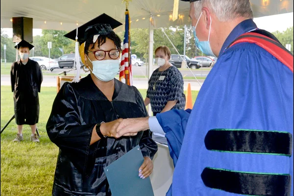 Grad fist bumps president