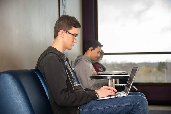 FLCC student uses a laptop to complete coursework and pursue an education.