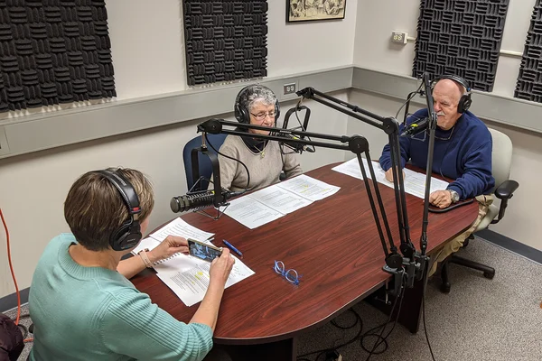 Three people making a podcast