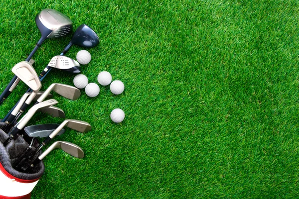 golf clubs on grass