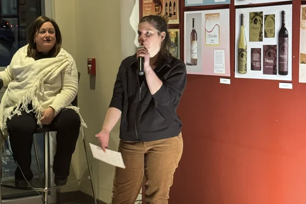 Lauren Turner presenting her design at the fall 2025 FLCC wine label design competition.