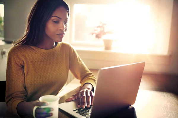 A student working from home on a laptop computer.