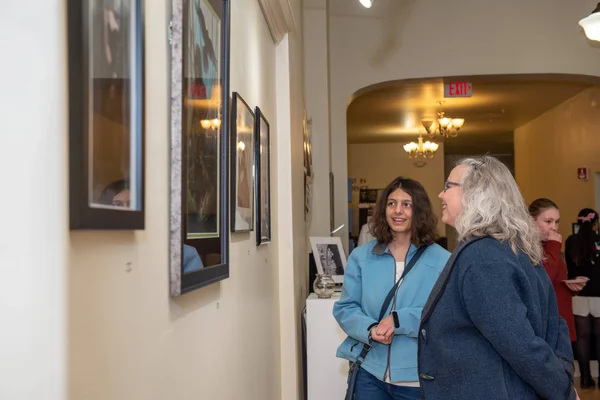 A student and guest viewing artwork at our downtown art gallery ArtSpace36.