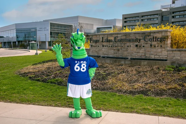 Flick, the FLCC mascot, waving to new students in front of main campus.