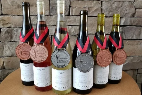 The 2019 Foundation vintage displayed with two silver and four bronze medals from the New York Wine Classic.