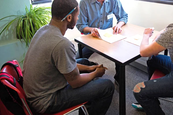 A student receiving support on a college paper at The Write Place.