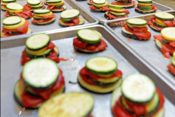 Sheet ban with stacked vegetables ready to cook