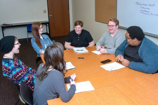 Members of Student Corporation in a meeting room, making decisions about life at FLCC.