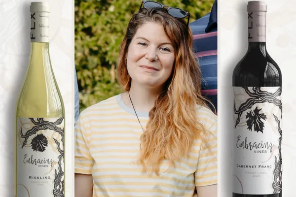 A photo of Lauren Turner between two of her wine label designs for FLCC's wine label competition