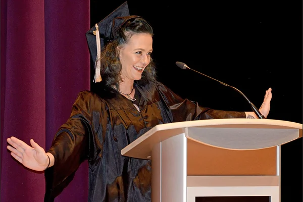Graduate speaking at podium