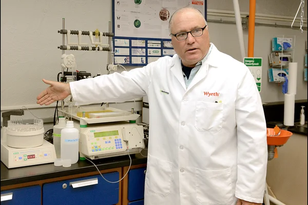 Faculty member in lab coat