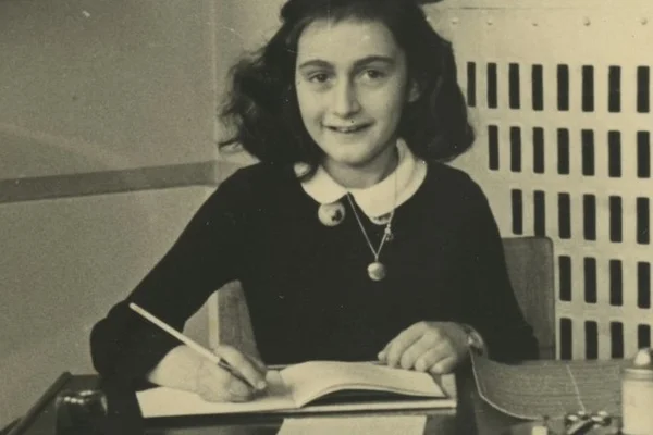 Black and white photo of girl at desk