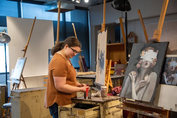 Student artist at work in the painting studio.