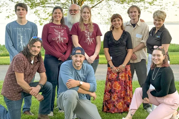A posed group of individuals for a team photo at the FLCC Viticulture and Wine Center.