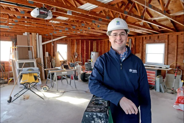 Man in hard hat at indoor worksite