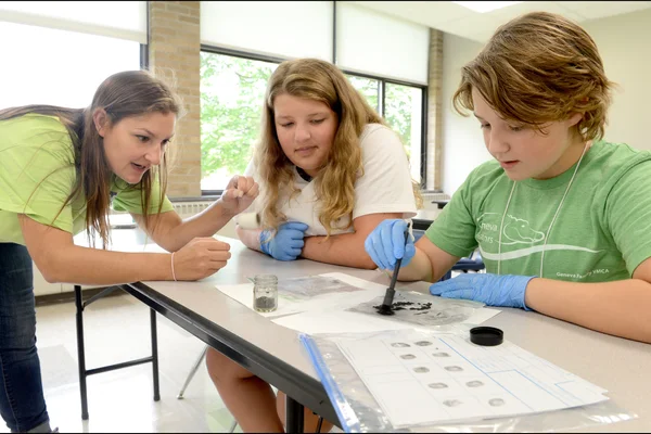 Instructor working with two middle school girls 
