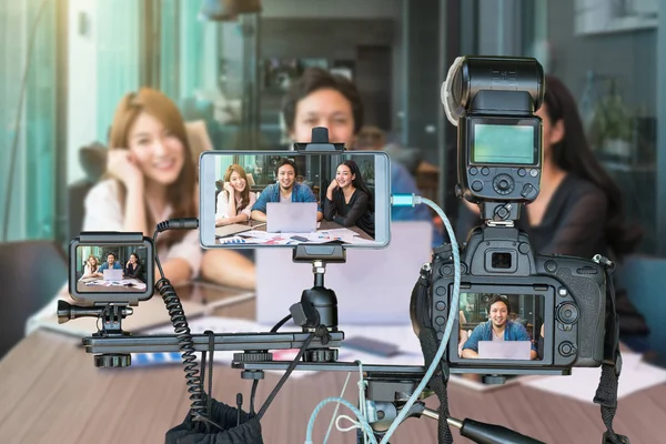 Multiple devices being used to record an event.