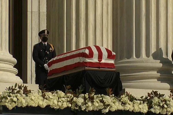 Three officers near the casket of Ruth Bader Ginsburg