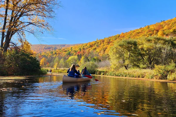 FLCC students canoeing in Honeoye Lake on a beautiful autumn day.