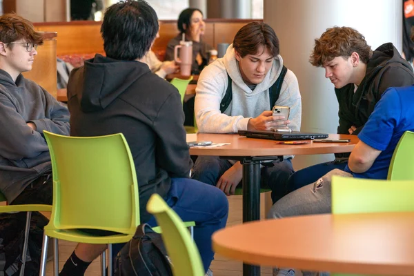 Students sit together in the cafeteria at FLCC.