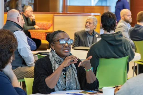 AI users collaborate, using technology to reach goals.