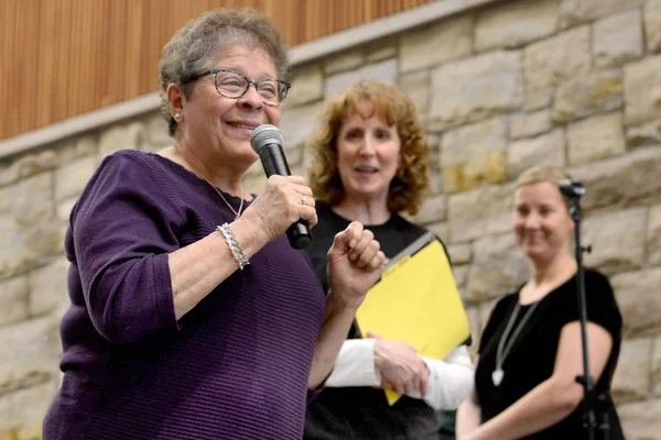 FLCC employee speaking at an event, engaging the audience with expertise and enthusiasm.