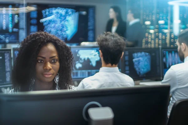 Students working at computer workstations.