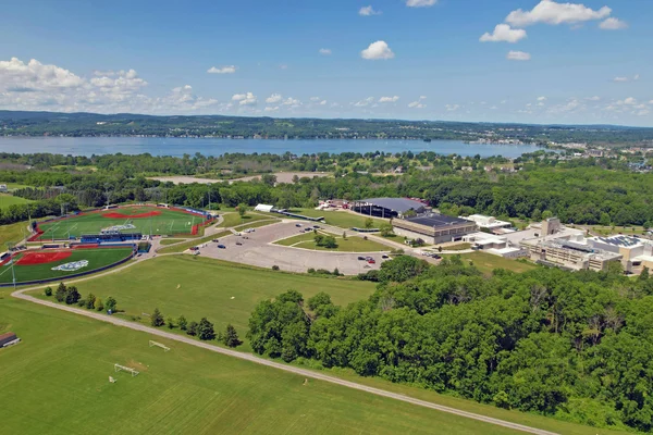 FLCC's main campus and athletic facilities seen from above with Canandaigua Lake in the background.