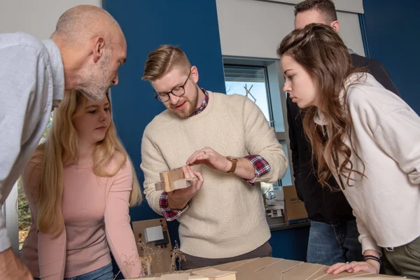 FLCC students working in a small group under the supervision of a faculty member.