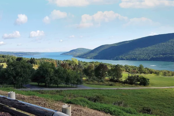 Canandaigua Lake and the surrounding tree-covered hills.
