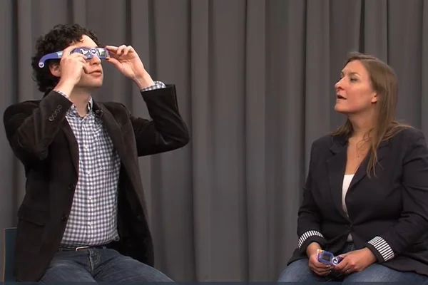 Man and woman on TV set