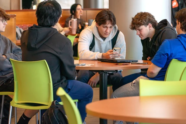 Students sit together in the cafeteria at FLCC.