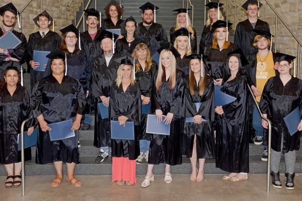 Adult basic education students graduating with their high school equivalency (HSE) diploma.