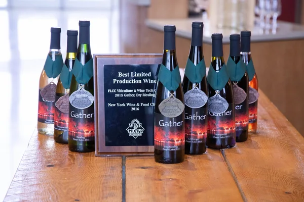 The 2015 Gather vintage displayed with one gold, three silver, and four bronze medals awarded by the New York Wine Classic.