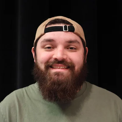 Head and shoulders photo of young man with beard