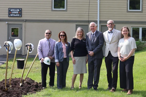 Six individuals posing for a photo after a ceremonial groundbreaking at Muller Field Station in Honeoye, NY.