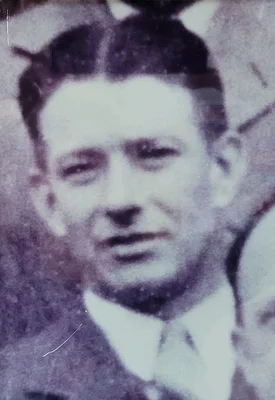 Black and white headshot of a man