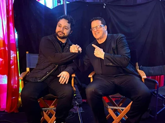 Noah Pitifer sitting next to his father, Mark on production set.