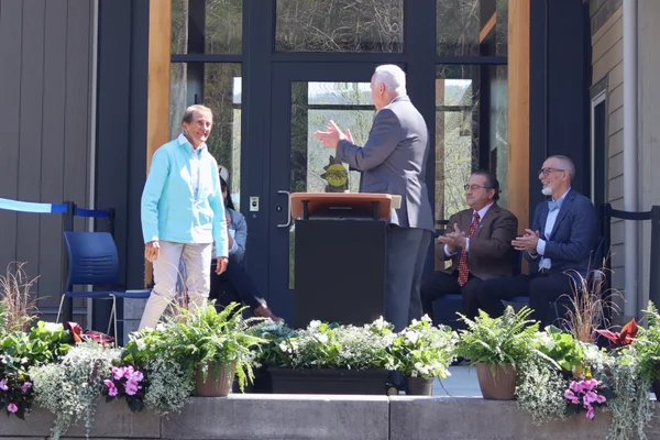 Nye and Rohland smiling at each other.