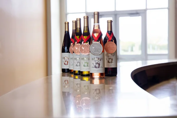 The 2017 Imprint vintage displayed with one silver and four bronze medals from the New York Wine Classic.