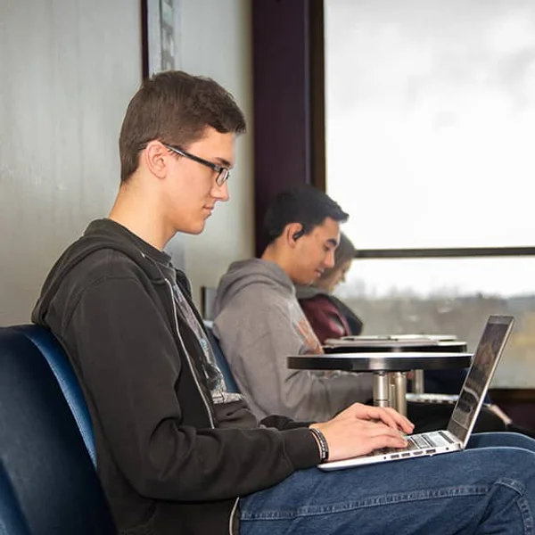 FLCC student uses a laptop to complete coursework and pursue an education.