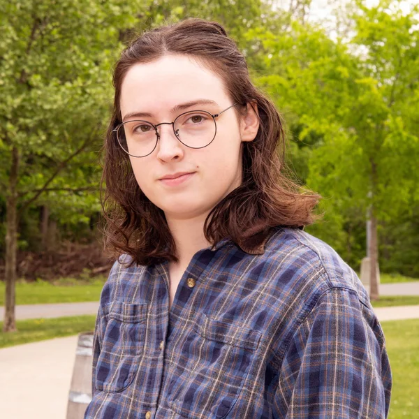 FLCC Environmental Science student holding a bear cub during a field work expedition.