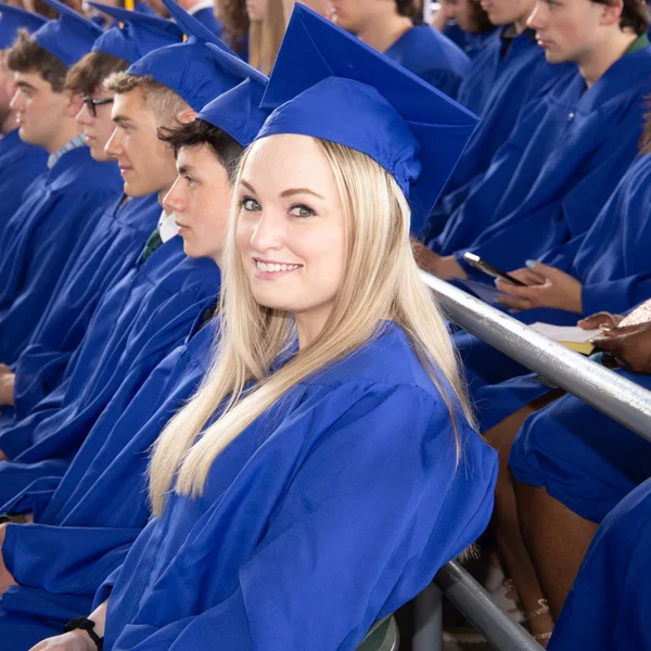 FLCC graduates celebrating their achievements and receiving their diplomas during the commencement ceremony.